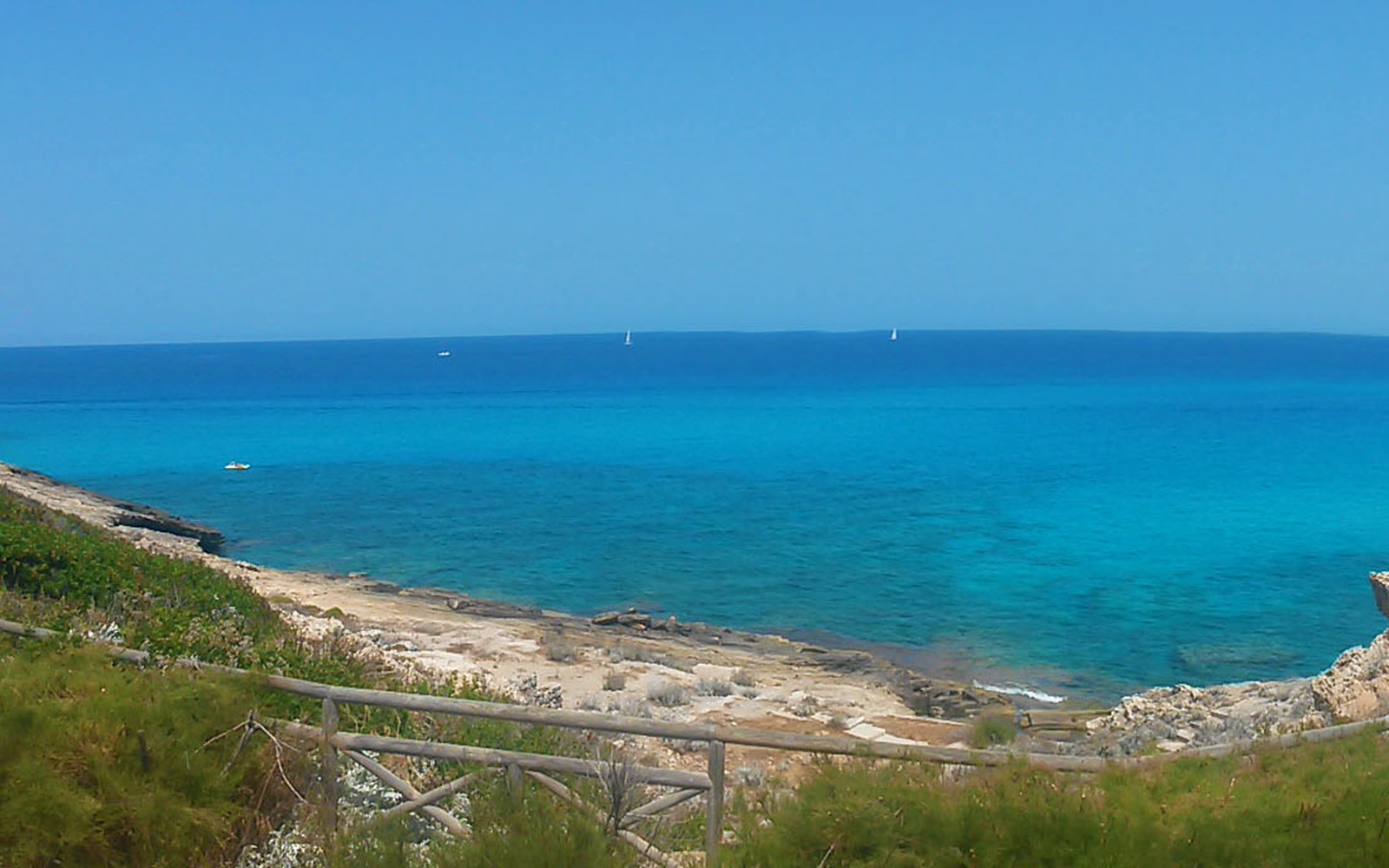 An empty cove between rock arms, flat light